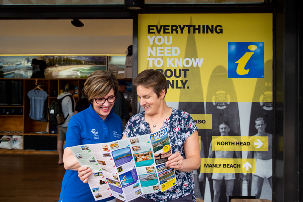 Friendly volunteers assist visitors navigate Manly's attractions 