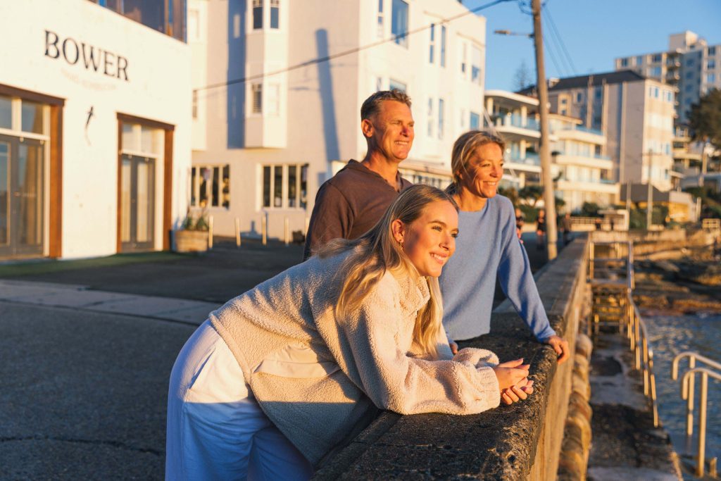 Family looks at the sunrise at the Bower Manly