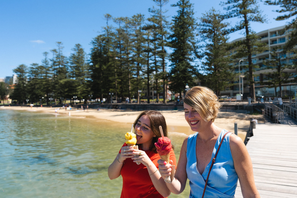 Mother and daughter enjoying ice cream at Manly wharf